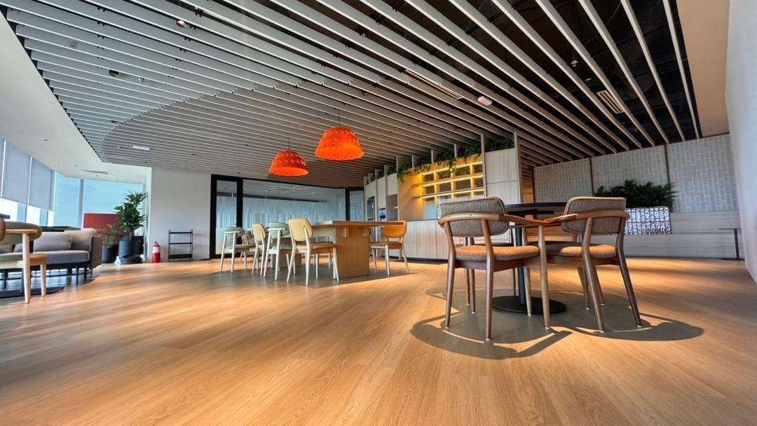 Long table in a completed DJS workplace
